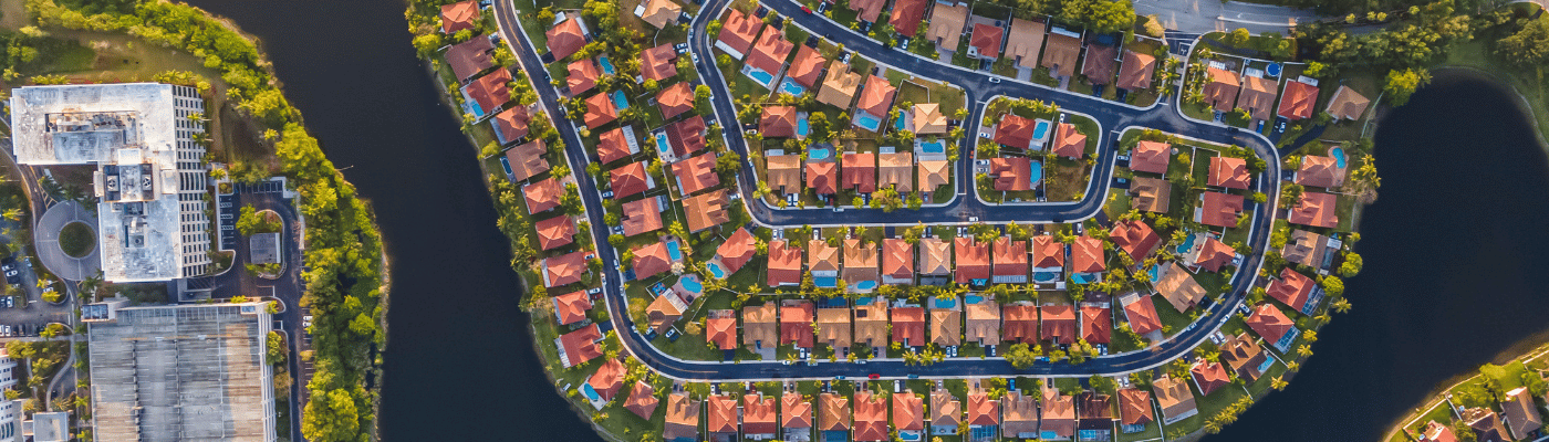 Aerial footage Florida suburbs and buildings in the sunset