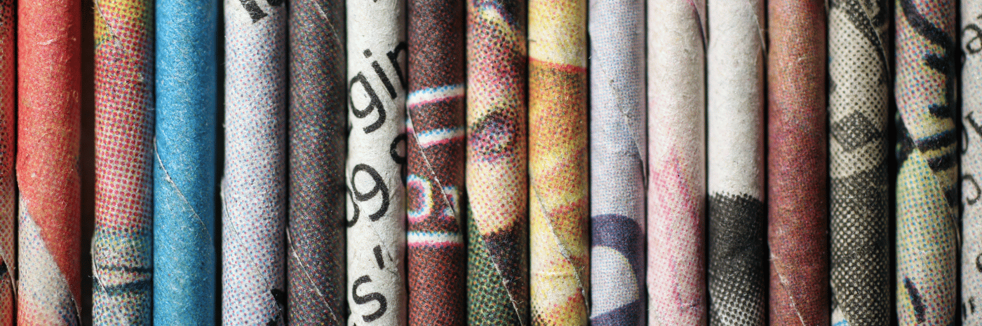 Rolled newspaper pages